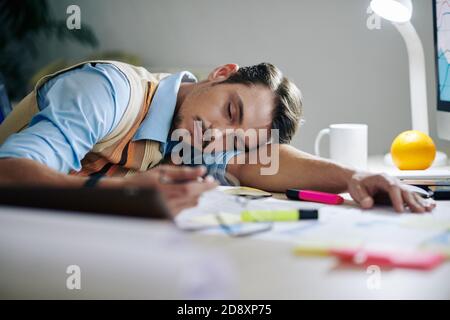 Exhausted entrepreneur fell asleep Stock Photo