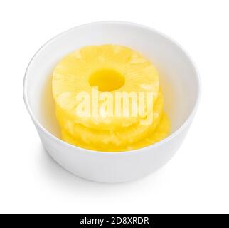 Pineapple rings ib a bowl. Fresh Pineapple slice isolated on white background. Close up. Top view Stock Photo