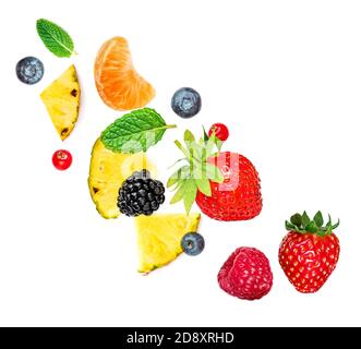 Creative layout made of summer fruits and mixed berries isolated on white background. Flat lay. Food concept. Stock Photo