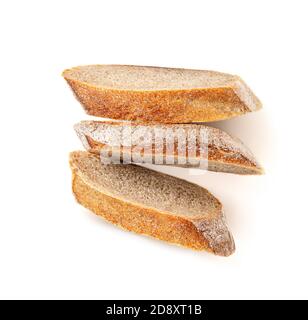 Freshly baked bread isolated on a white background. Crumbs and Bread slice close up. Top view Stock Photo