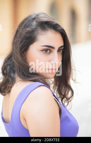 Beautiful pensive woman looking away outdoors Stock Photo
