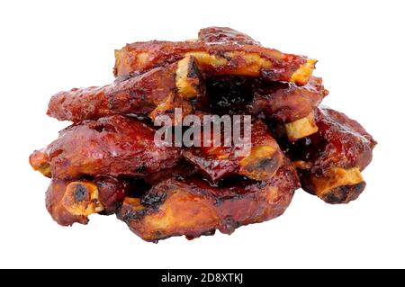Group of mini pork ribs coated in sticky barbecue sauce isolated on a white background Stock Photo