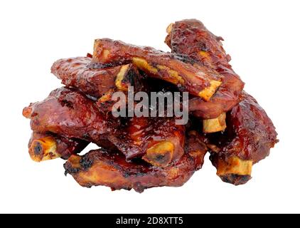 Group of mini pork ribs coated in sticky barbecue sauce isolated on a white background Stock Photo