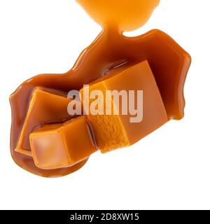 Caramel candies isolated on a white background. Caramel pieces with sauce close up Stock Photo