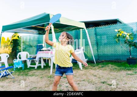 A girl has fun in a garden Stock Photo