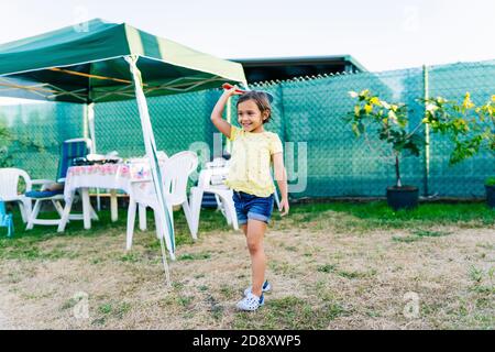 A girl has fun in a garden Stock Photo