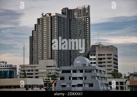 This unique photo shows the concrete desert of Bangkok in Thailand! one recognizes flat buildings in the foreground and a high one in the background Stock Photo