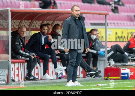 Cologne, Germany. 31st Oct, 2020. Hansi FLICK (coach, M) in front of the bench, behind Hasan SALIHAMIDZIC (Sports Director, M), Soccer 1st Bundesliga, 6th matchday, FC Cologne (K) - FC Bayern Munich (M) 1: 2, on October 31, 2020 in Cologne, Germany. Credit: Elmar Kremser/Sven Simon/Pool # DFL regulations prohibit any use of photographs as image sequences and/or quasi-video # # Editorial use only # # National and international News- Agencies OUT # ¬ | usage worldwide/dpa/Alamy Live News Stock Photo