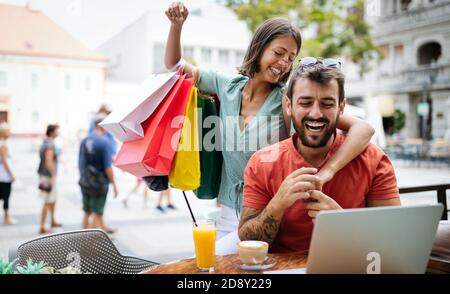 Couple having fun at a restaurant. Shopping, date, work, happy people concept. Stock Photo