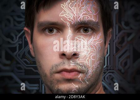 Artificial intelligence concept. Face of man with electronic circuit. Stock Photo