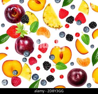 Food Summer  pattern made  of fruits and berries isolated on white background. Flying mixed Strawberry, Raspberry, Pineapple, Blueberry and Mint leaf, Stock Photo