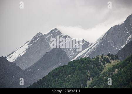 Amazing view of touristic trail near the Matterhorn in the Swiss Alps at cloudy weather Stock Photo