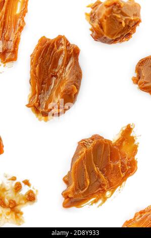 Caramel Pattern. Soft melted caramel isolated on white background, top view Stock Photo