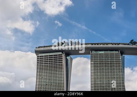 Singapore - December 4, 2019: Detail of modern skyscraper building in Marina bay sands, abstract architectures and cloudy sky in Singapore. Stock Photo