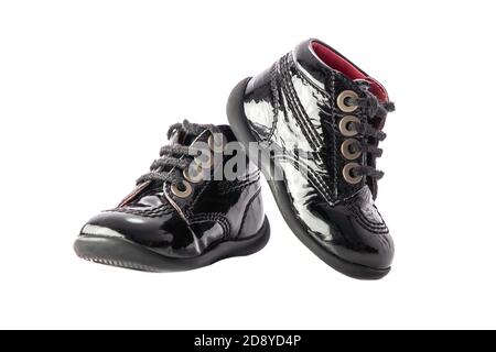 Fashion leather black baby shoes isolated on white background. Stock Photo