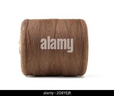 large spool with brown cotton thread isolated on white background, close up Stock Photo
