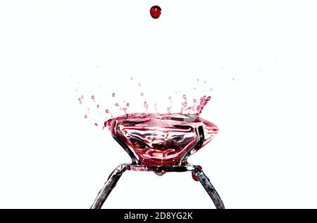 Red Water Drops Falling on a Blood Diamond Ring in Switzerland. Stock Photo
