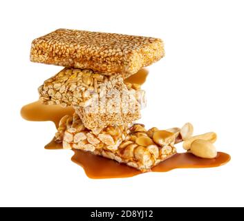 Nut bars isolated on white background. Heap of Granola energy cereal bars Stock Photo