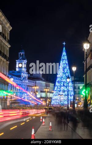 MADRID, SPAIN - JANUARY 4, 2020: Crowds of people gather at the Puerta del Sol square in Madrid, Spain, with the traditional illuminated Christmas tre