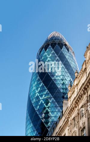 The Gherkin (30 St. Mary Axe) by Norman Foster, neoclassical 19th Century office buildings, City of London, downtown, financial district, London, UK Stock Photo