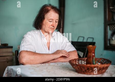 Close-up portrait of an elderly woman, looking worried Stock Photo