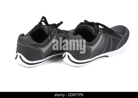 Pair of black women sneakers isolated on white background. High resolution photo. Full depth of field. Stock Photo