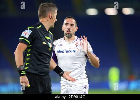 The referee Daniele Orsato and Franck Ribery of Fiorentina talk to each other during the Italian championship Serie A football match between AS Roma C Stock Photo