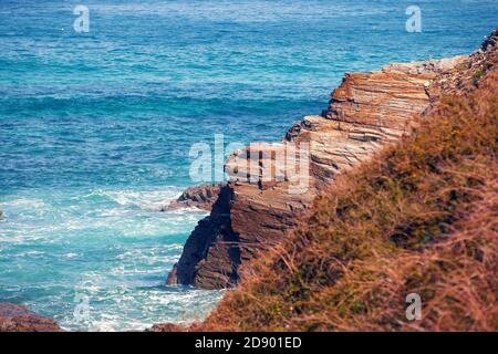 Seascape on a sunny day. Rocks in the ocean. Beach Playa de Las Catedrales in Ribadeo, Galicia, Spain, Europe Stock Photo