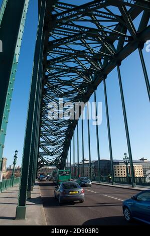 Traffic crossing the Tyne Bridge linking Newcastle upon Tyne and Gateshead in the North East of England. Stock Photo
