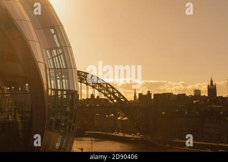View of the Sage Gateshead, concert venue and the Tyne Bridge crossing from Gateshead to Newcastle upon Tyne, in North East England. Stock Photo