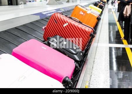 Baggage luggage on conveyor carousel belt at airport arrival Stock Photo