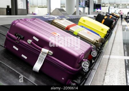 Baggage luggage on conveyor carousel belt at airport arrival Stock Photo