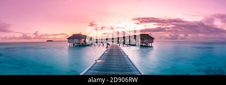 Panorama sunset landscape in Maldives. Beautiful twilight sky and colorful clouds. Beautiful beach background for vacation holiday banner