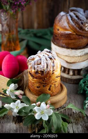 Easter cake kraffin. Kraffins with raisins, candied fruits and poppy seeds, sprinkled with powdered sugar. Close-up of homemade cake. Cruffin. Red Stock Photo