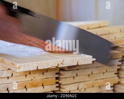 A worker cuts beef at a meat processing plant in Avellaneda on the ...