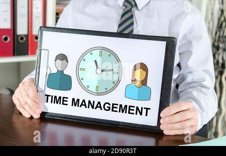 Time management concept shown by a businessman Stock Photo