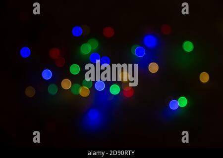 Abstract background, multicolored bokeh on a black background. Stock Photo