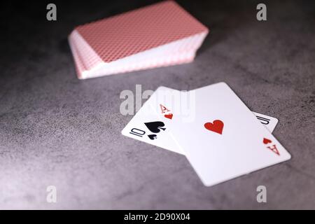 A pair of aces on a deck of playing cards on a table. Online gambling. Gambling addiction Stock Photo