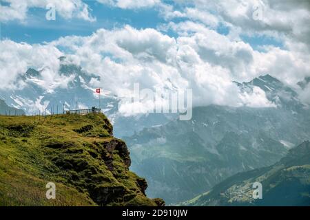 Viewpoint at mountain Männlichen over the Lauterbrunnen valley on a cloudy day in summer. Jungfrau region, Bernese Oberland, Switzerland Stock Photo