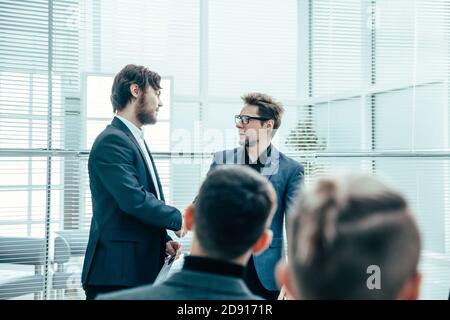 business colleagues shaking hands with each other . Stock Photo
