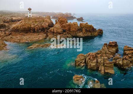 Brehat island in Brittany, aerial view from the sea of the Paon lighthouse and point.
