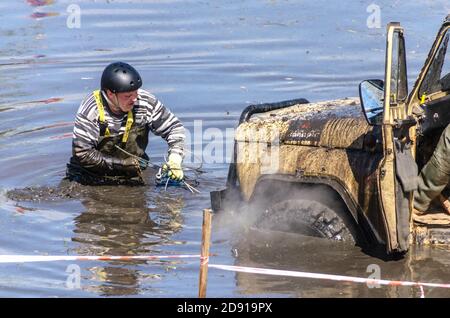 SALOVKA, RUSSIA - MAY 5, 2017: Four-wheel dirve crosses the mud obstacle on the distance of racing Stock Photo