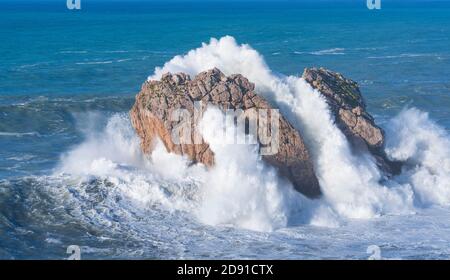 Swell in the Cantabrian Sea. Big waves in the so-called 'Puerta del Cantabrico' on the cliffs of Liencres. Municipality of Piélagos in the Autonomous Stock Photo