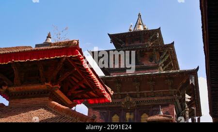 Temple roofs with wooden ornaments (Newari art) at Kathmandu Durbar Square (UNESCO World Heritage Sites) in Nepal. Stock Photo