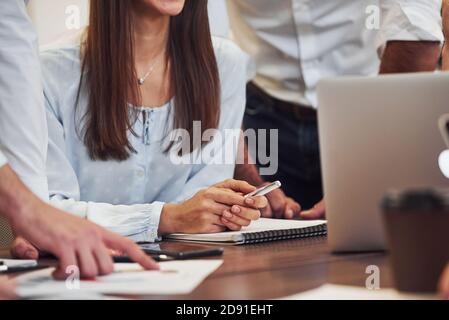Close up view of business people that sitting and working together in the modern office Stock Photo