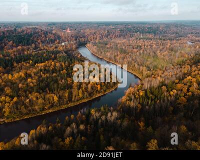 Epic autumn flight over Gauja river valley with Turaida castle in background Stock Photo