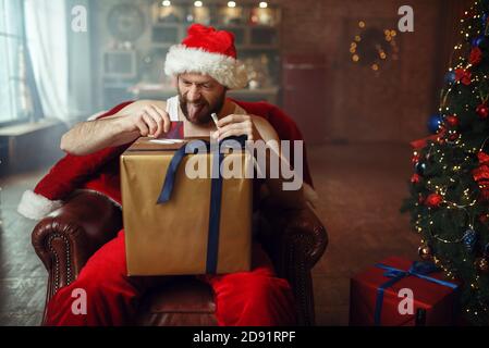 Bad Santa claus takes drugs, cocaine party, humor Stock Photo