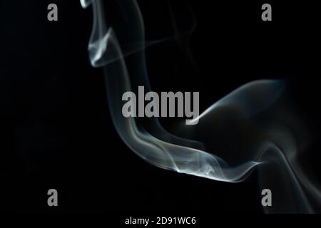 Abstract flowing Blue wispy smoke on dark background Stock Photo