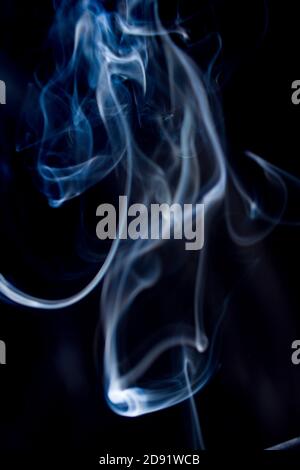 Abstract flowing Blue wispy smoke on dark background Stock Photo