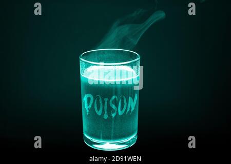 A glass with the inscription poison in x-ray light. A glass of dirty hot liquid Stock Photo